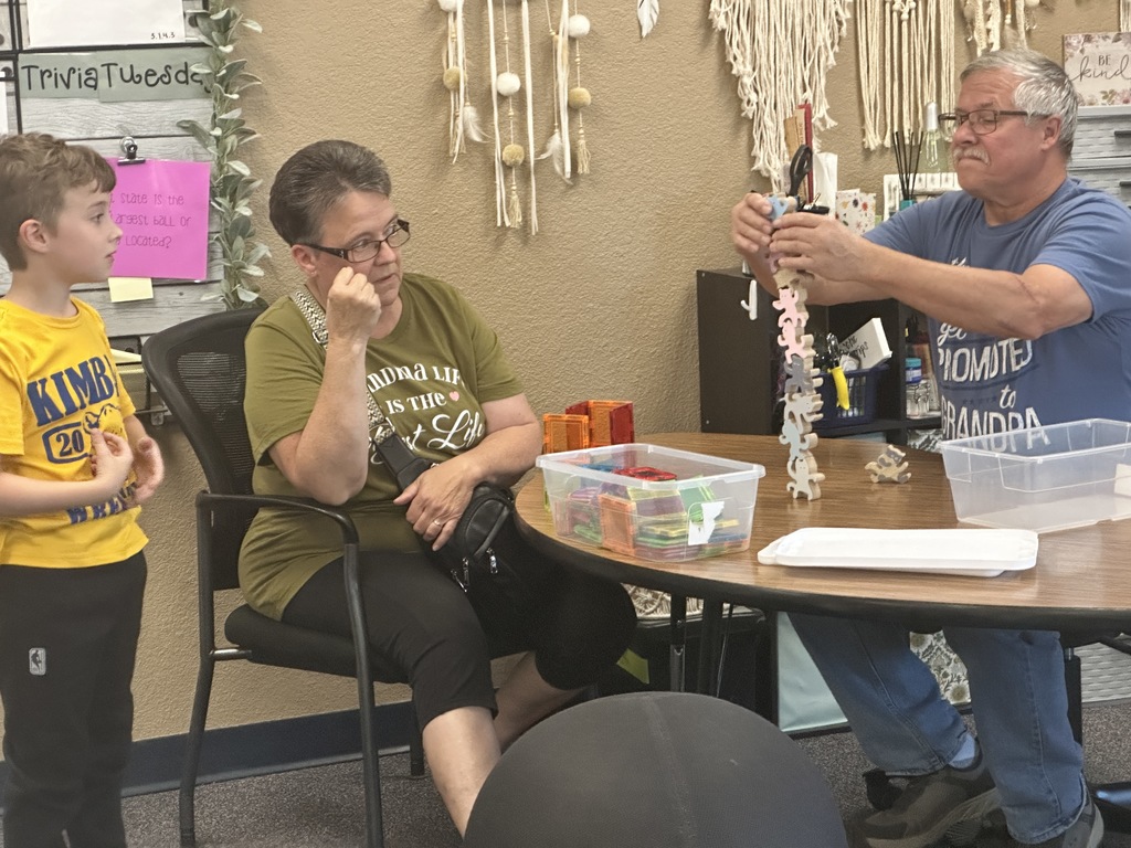 grandparent building a tower for student