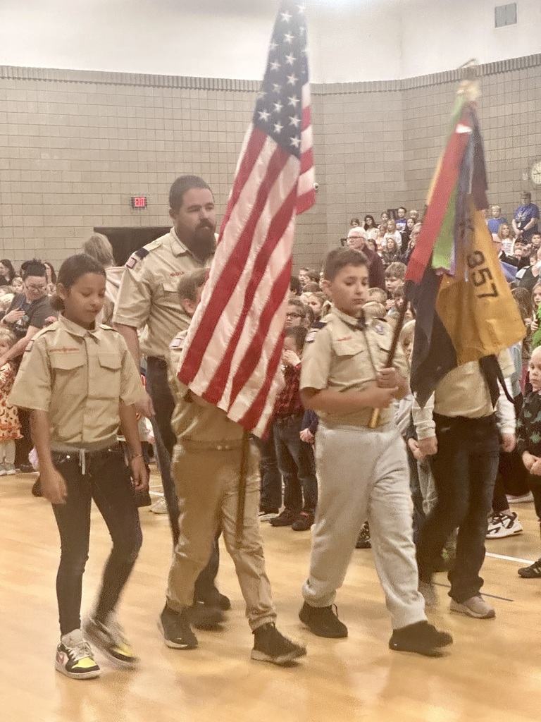 cub scouts presenting flags