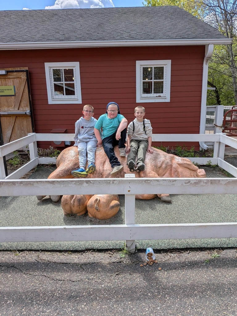 3 boys on pig statue
