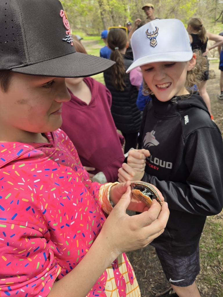 student holding turtle