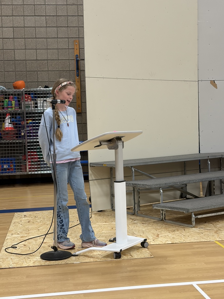 students giving speech at podium