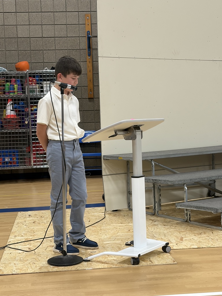students giving speech at podium