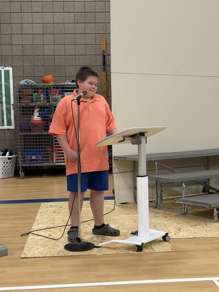 students giving speech at podium