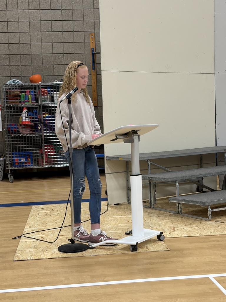 students giving speech at podium