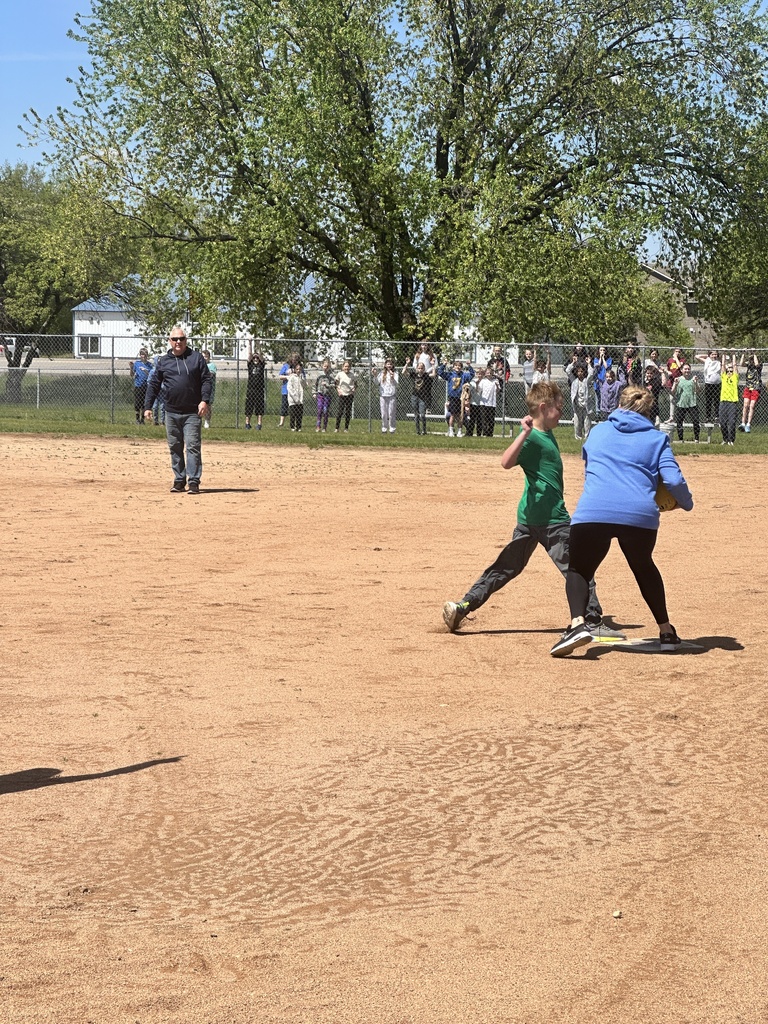 teacher tagging student out in kickball