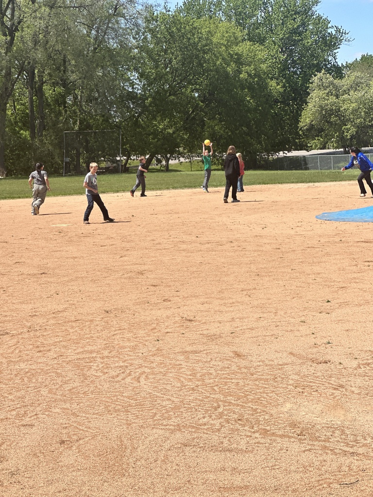 student making a catch in kickball
