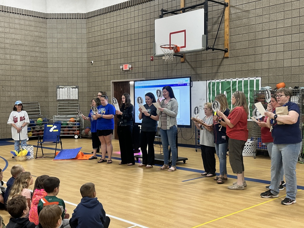 teachers lined up and singing to Mrs. Welter