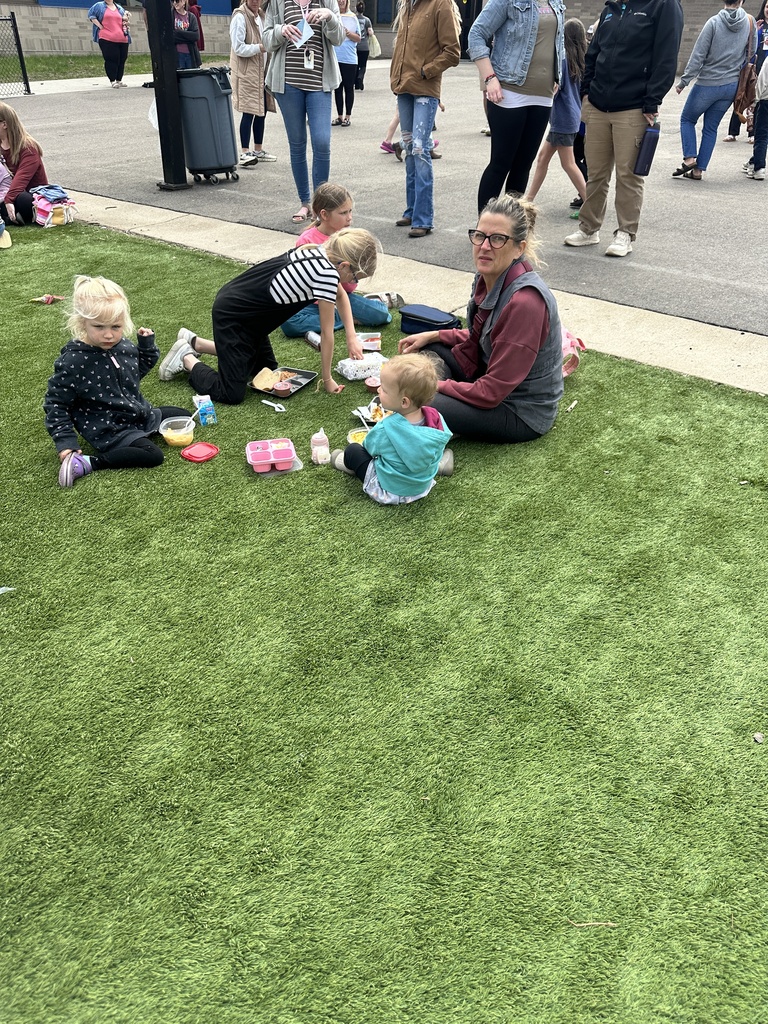 families having lunch on the playground