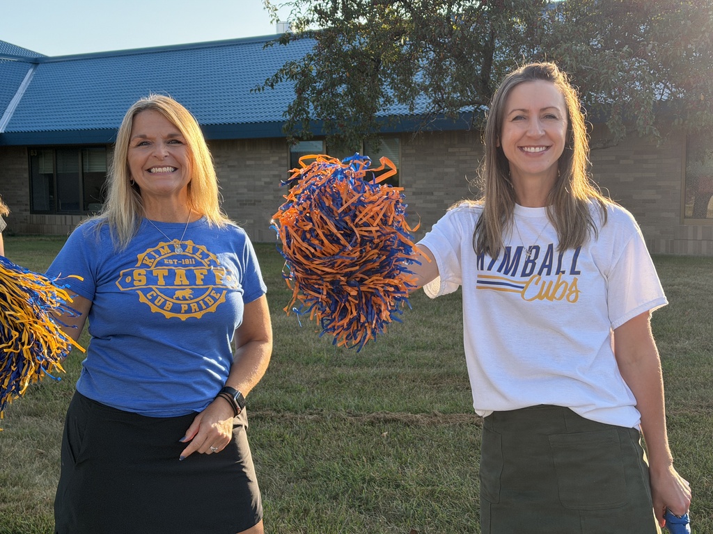 teachers waving pom poms