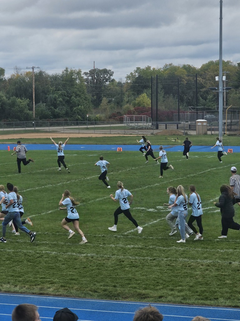 Senior girl scores touchdown during Powderpuff Football