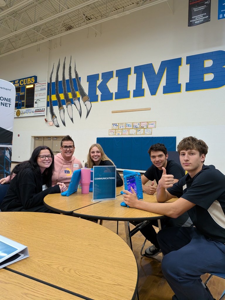 Students with their volunteer at Finance Park