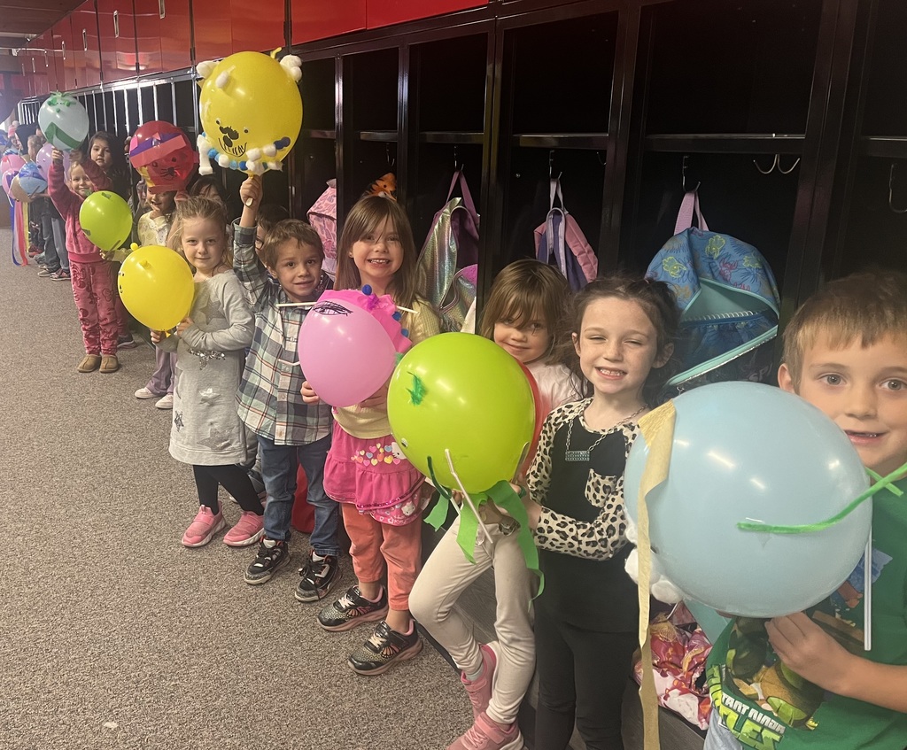 Students with parade balloons