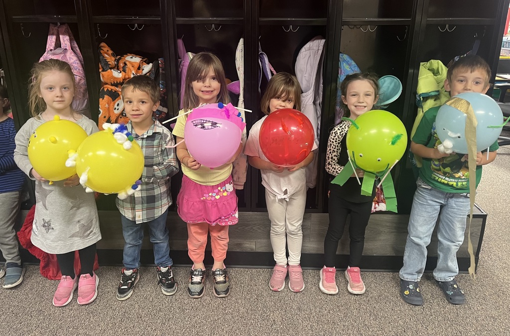 Students with parade balloons