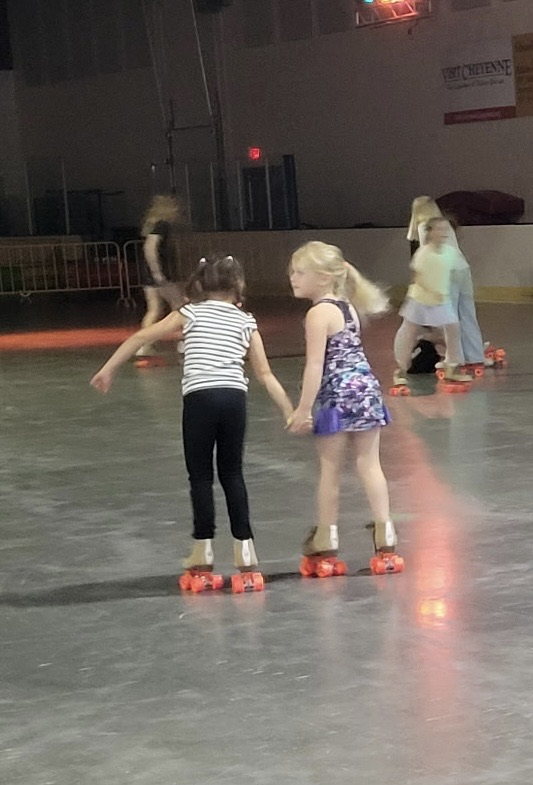 two girls skating