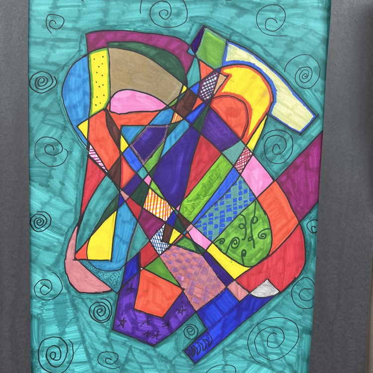 Abstract art with multiple colors and shapes displayed in a frame with a teal background.