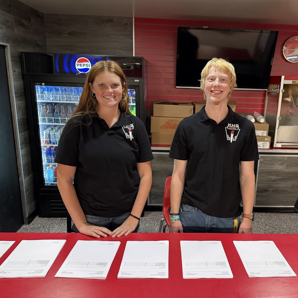 Karsyn C. & Connor M. handing out report cards at conferences