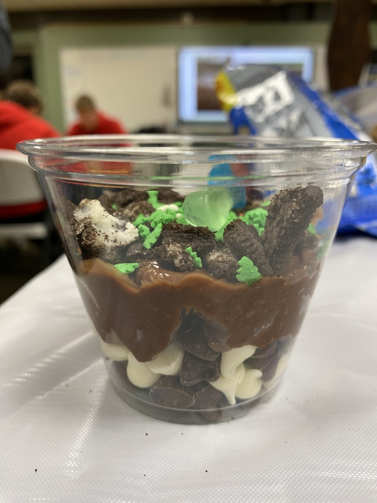Soil horizon dirt in a cup lab.