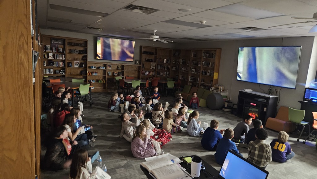 Elementary students enjoying an after school movie event.