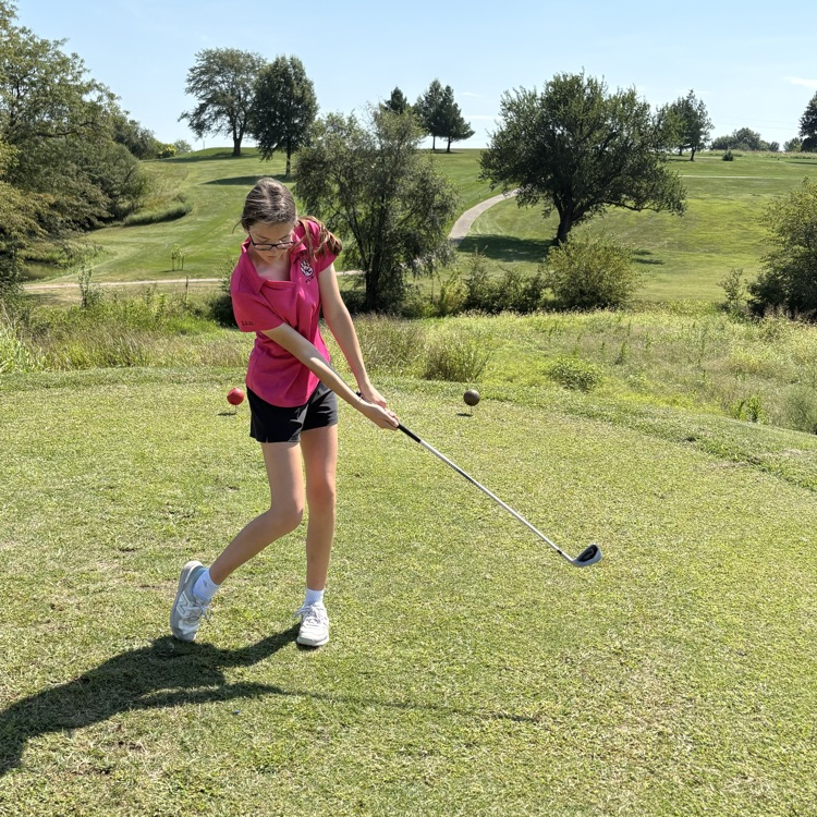 Clara tee’s off.