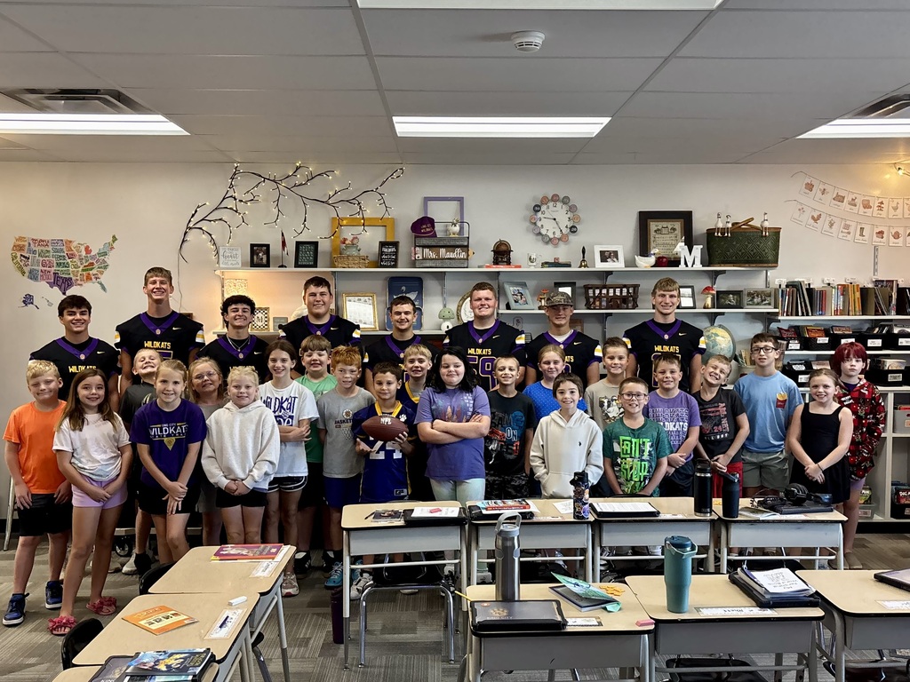 Class with football players and football