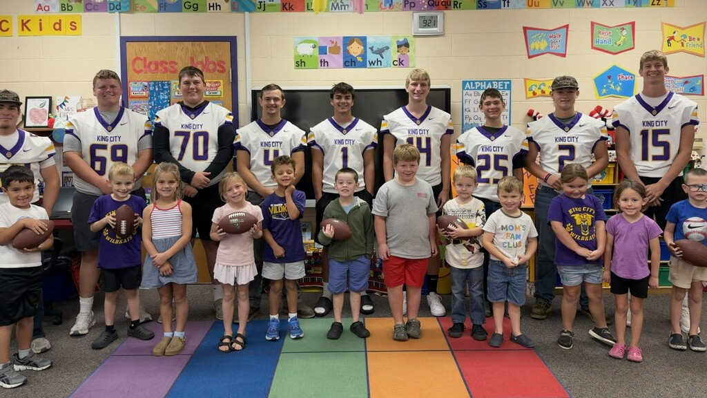 Class with football players and football