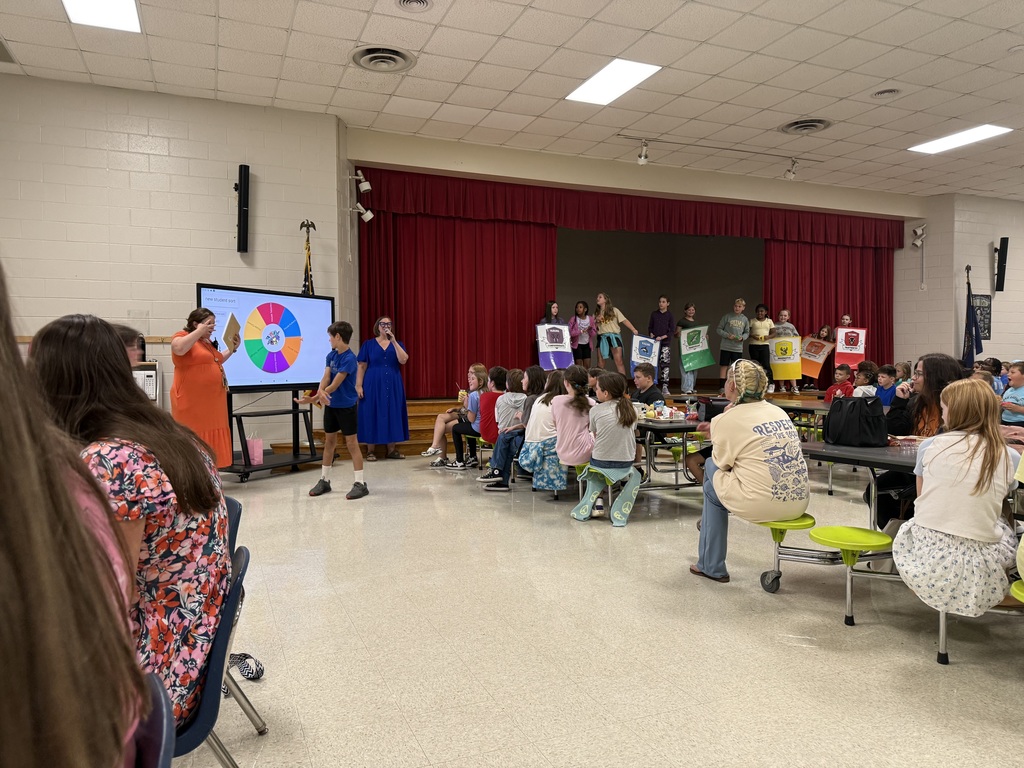 Students cheering as a student spins the wheel to find out his HOUSE.