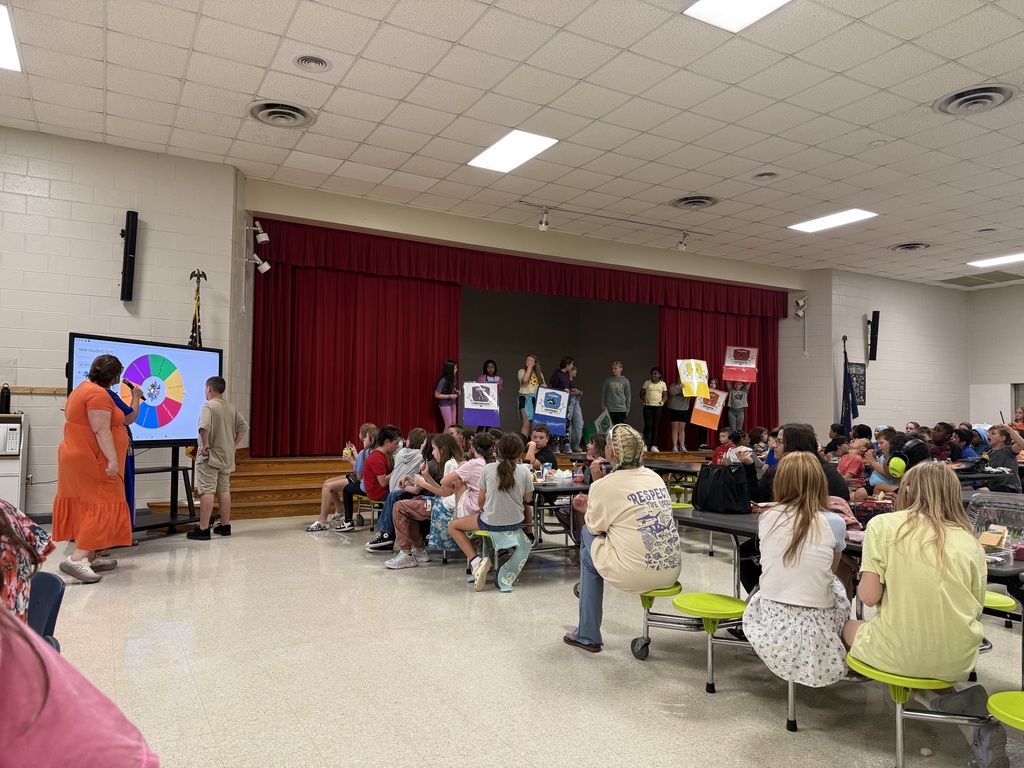Students cheering as a student spins the wheel to find out his HOUSE.