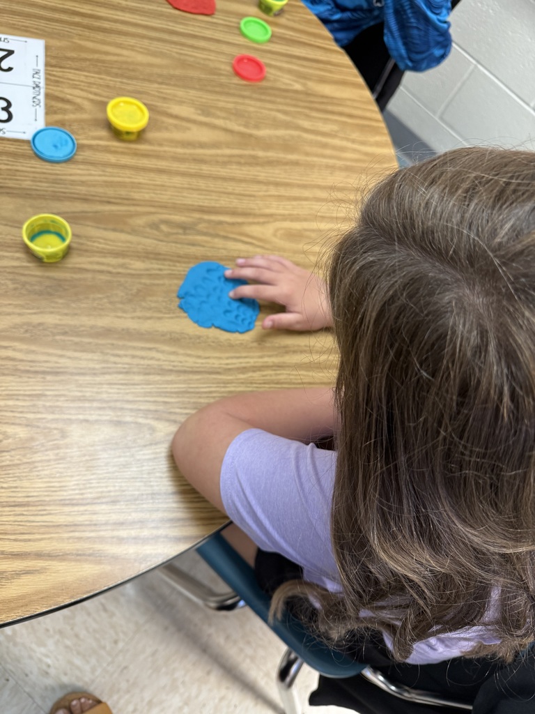 Students practicing multiplication facts using play-doh
