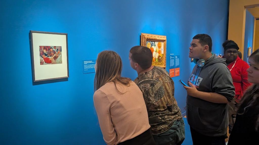 Students looking at a Freida Khalo painting