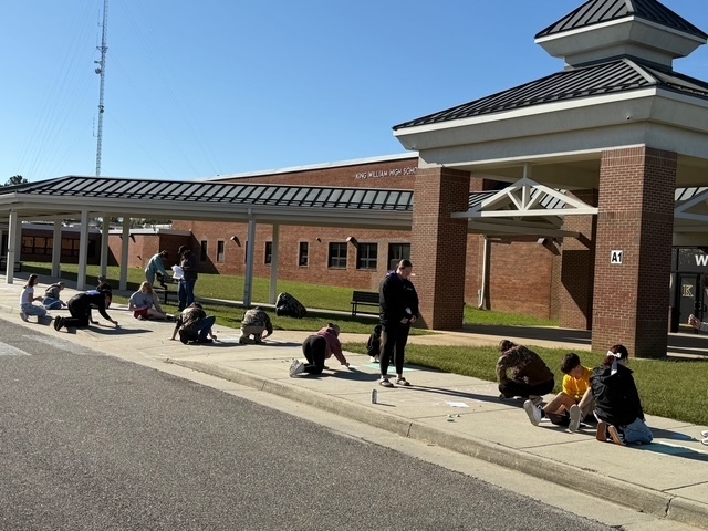 Constitution chalk drawings at the front of the school