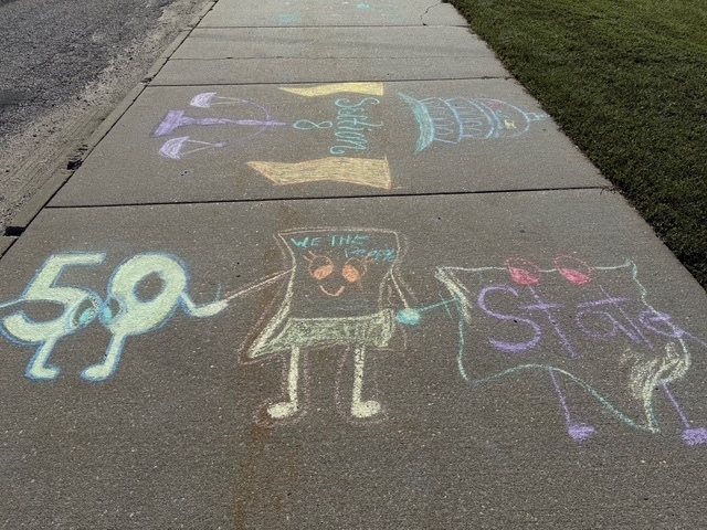 Constitution chalk drawings at the front of the school