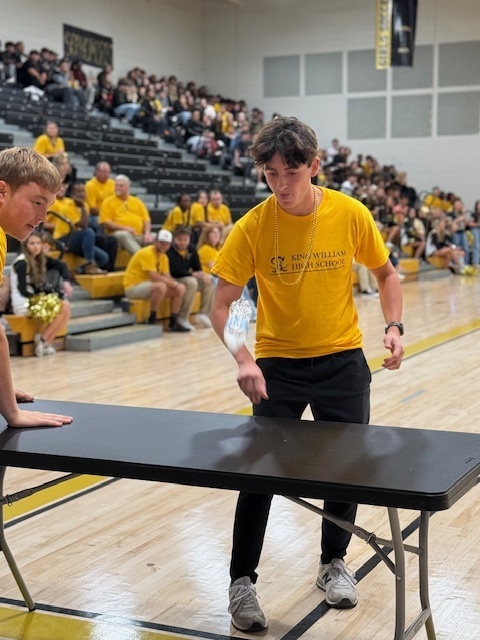 Homecoming pep rally games flip the bottle race
