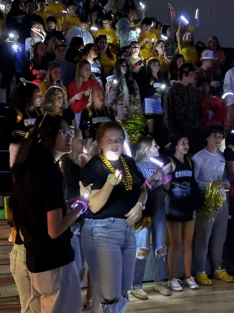 Homecoming pep rally  - students with glow sticks