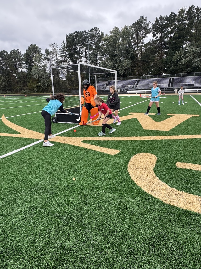 Field Hockey camp players in a skrimage game