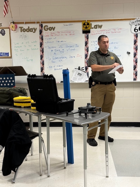 Investigator Boyd shows tools used in his field of work