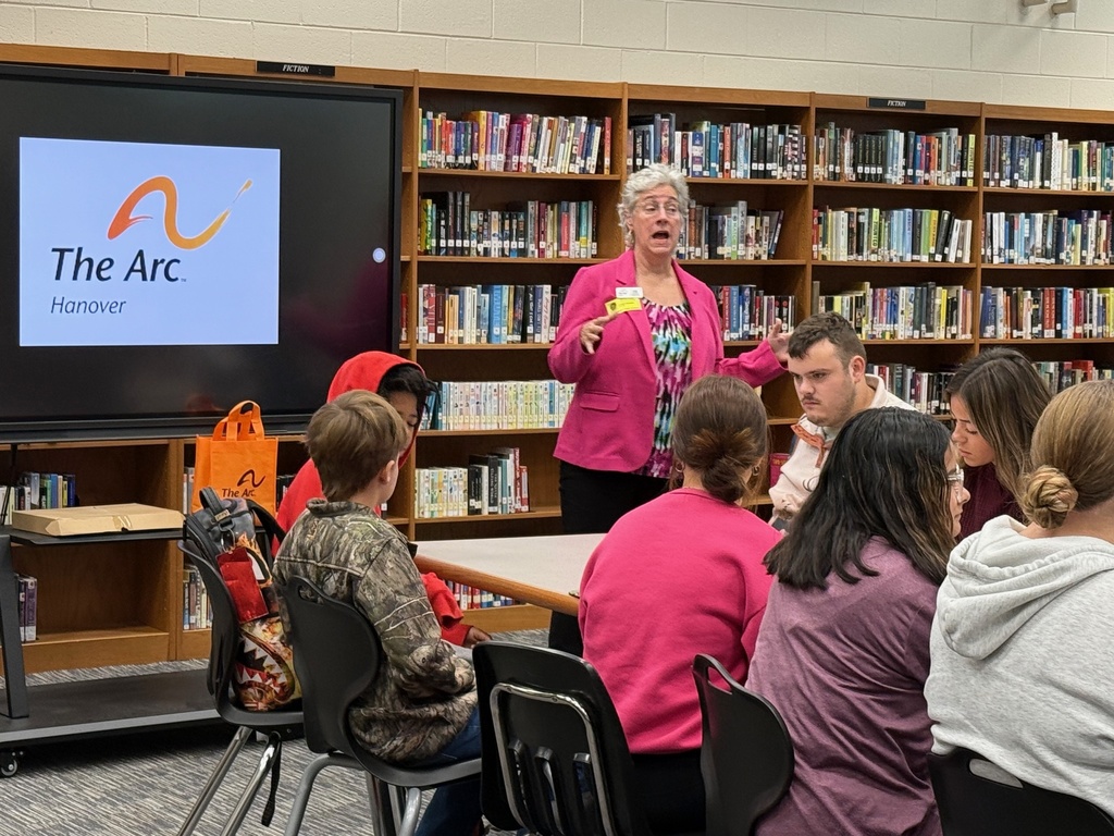 Students listening to Ms. Rooke from The Arc of Hanover 