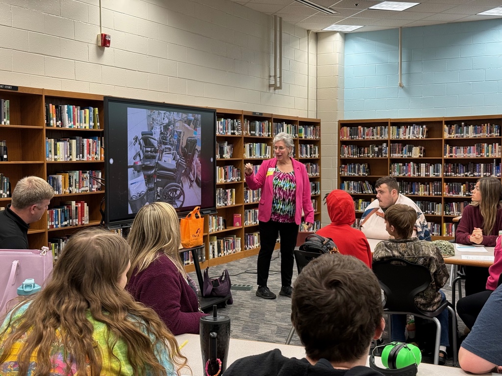 Students listening to Ms. Rooke from The Arc of Hanover 