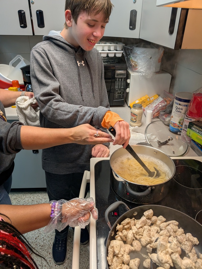 Student cooking pasta on the stove