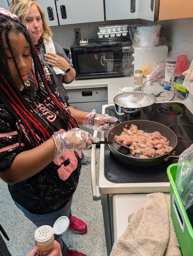 Students cooking  food 
