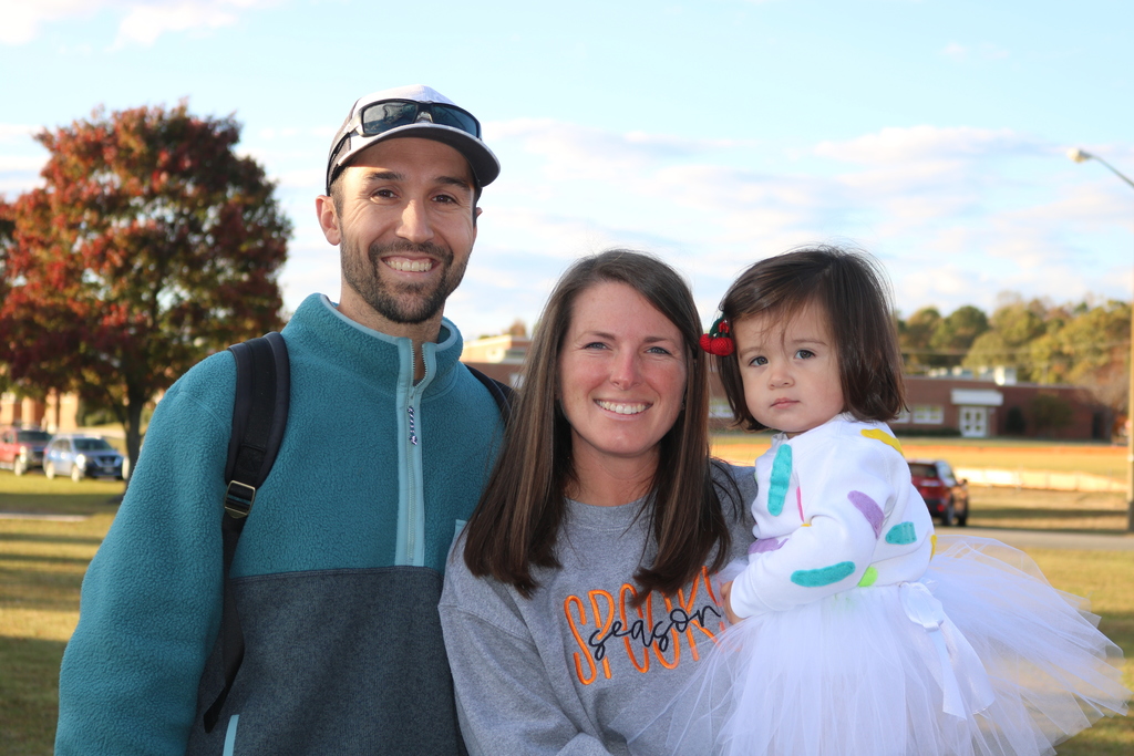 Mom, dad, and little girl in a perincess dress