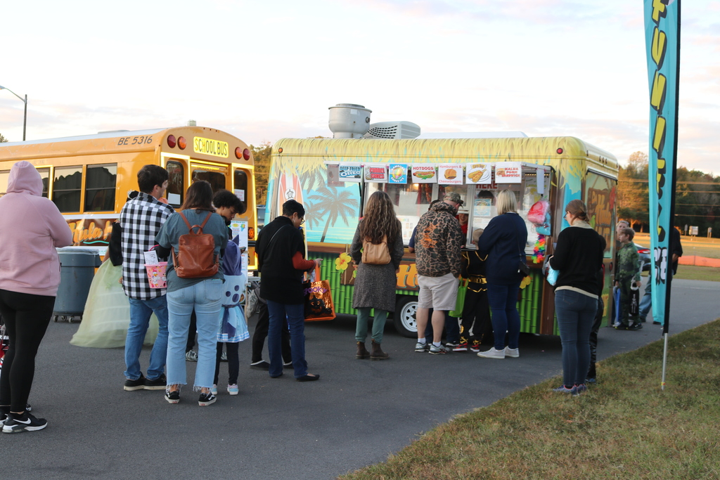Families in line at a food truck at the Trunk or treat