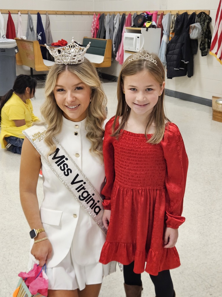 Miss Virginia poses with a lucky Eagle who is also wearing a tiara