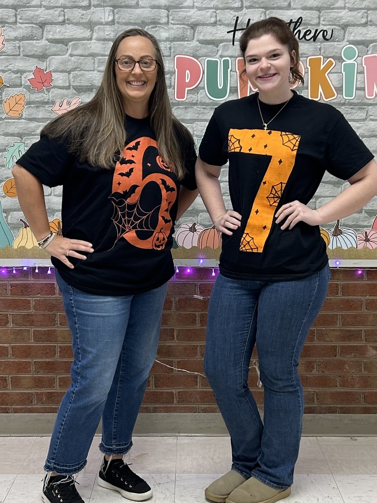 2 Teachers wearing Halloween tshirts that say 6-7