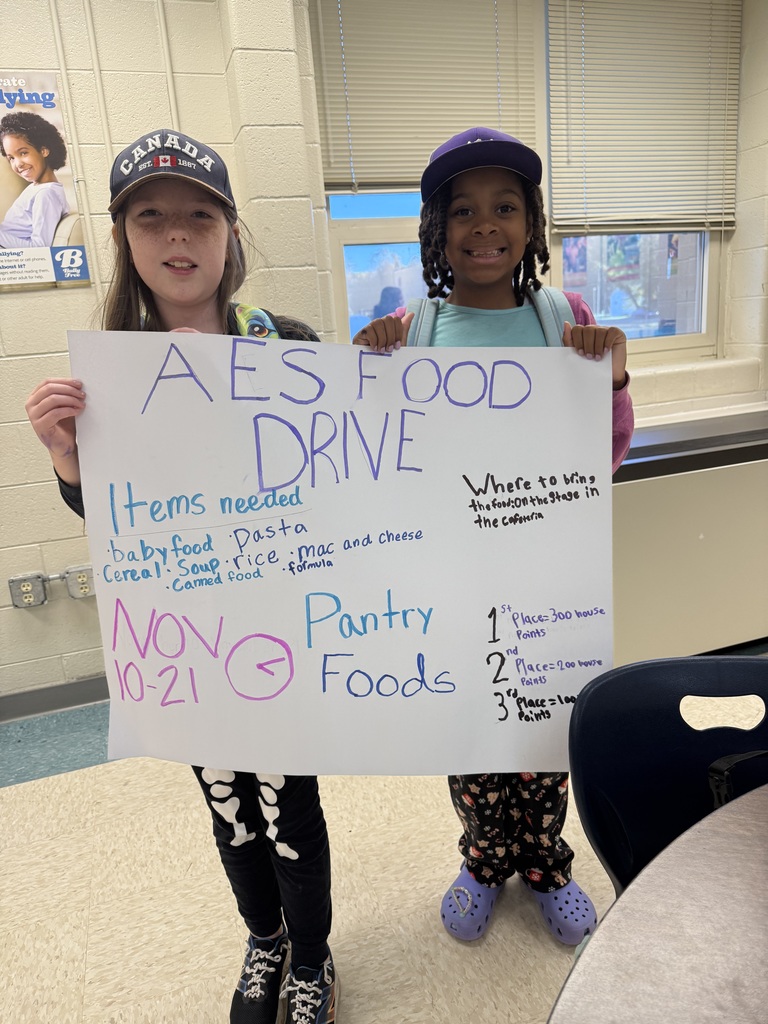 Students promoting AES Food Drive