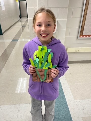 A student showcases their turkey project