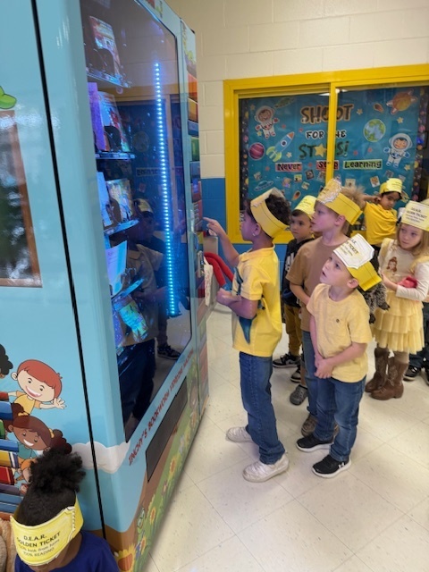 Students at the book vending machine
