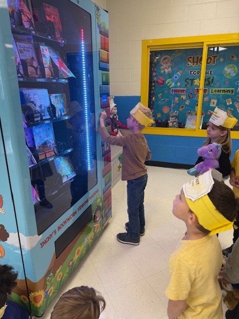 Students at the book vending machine