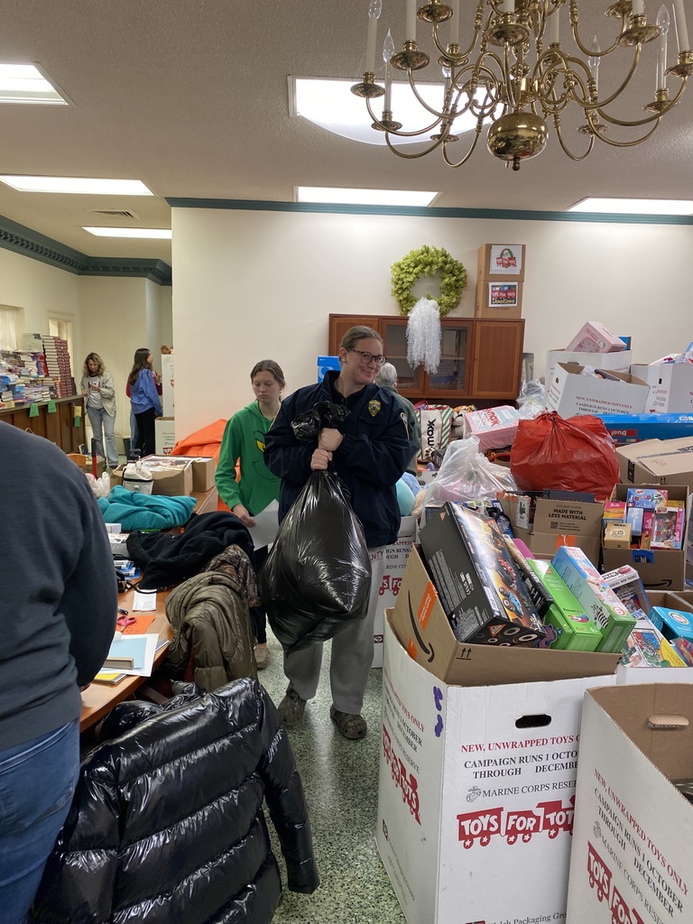 Service Learning Students helping to sort Toys for Tots