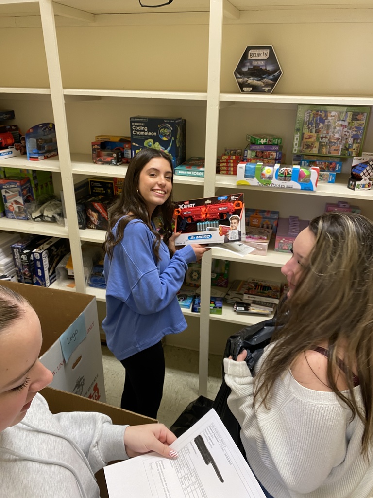 Service Learning Students helping to sort Toys for Tots