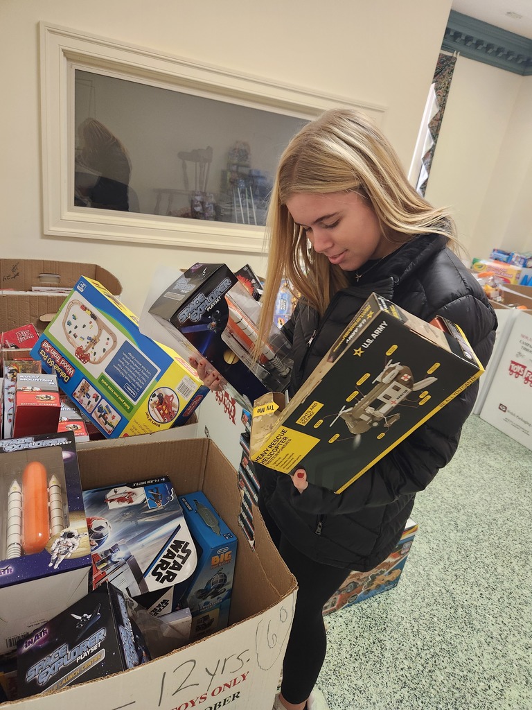 Service Learning Students helping to sort Toys for Tots